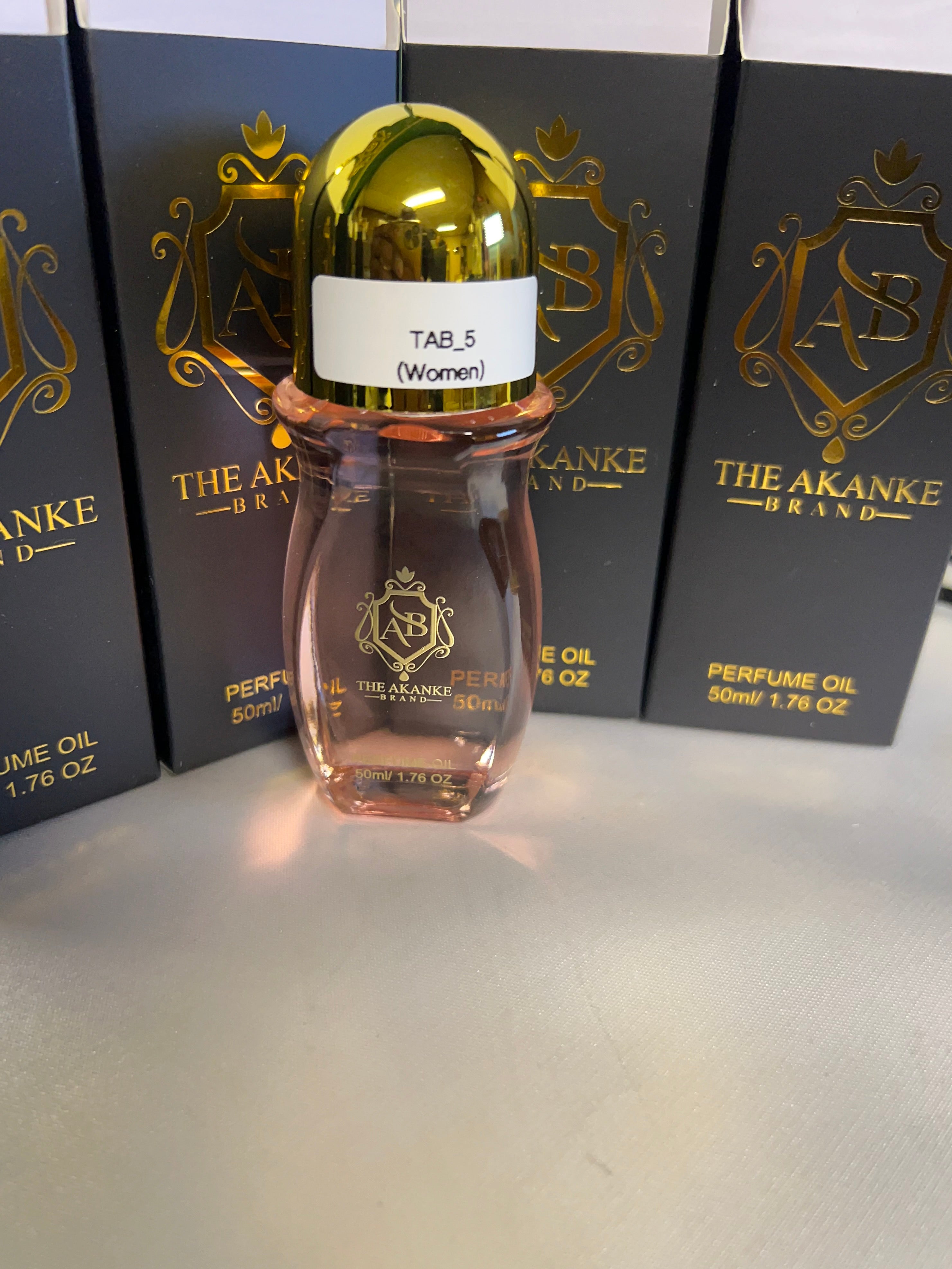 Perfume oil TAB NO5(women)50ml Fruitand Quince; middle notes are Peony and Freesia; base notes are Sugar, Almond Cream, Amber, Sandalwood and Musk